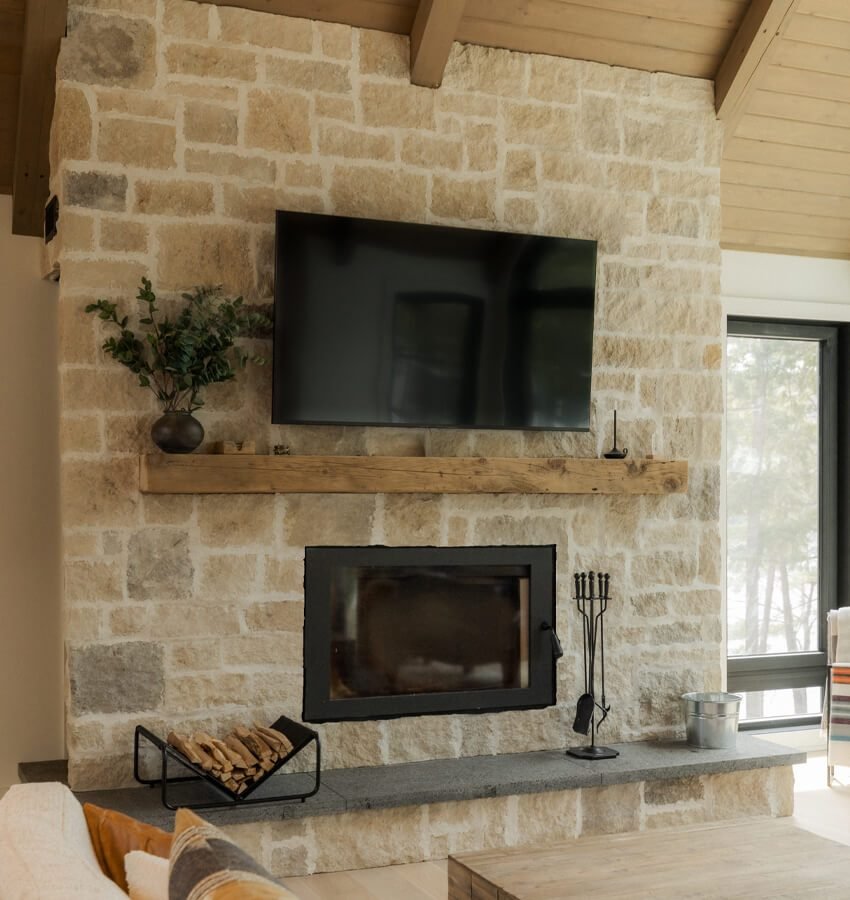 Stone fireplace in the living room at The Crag