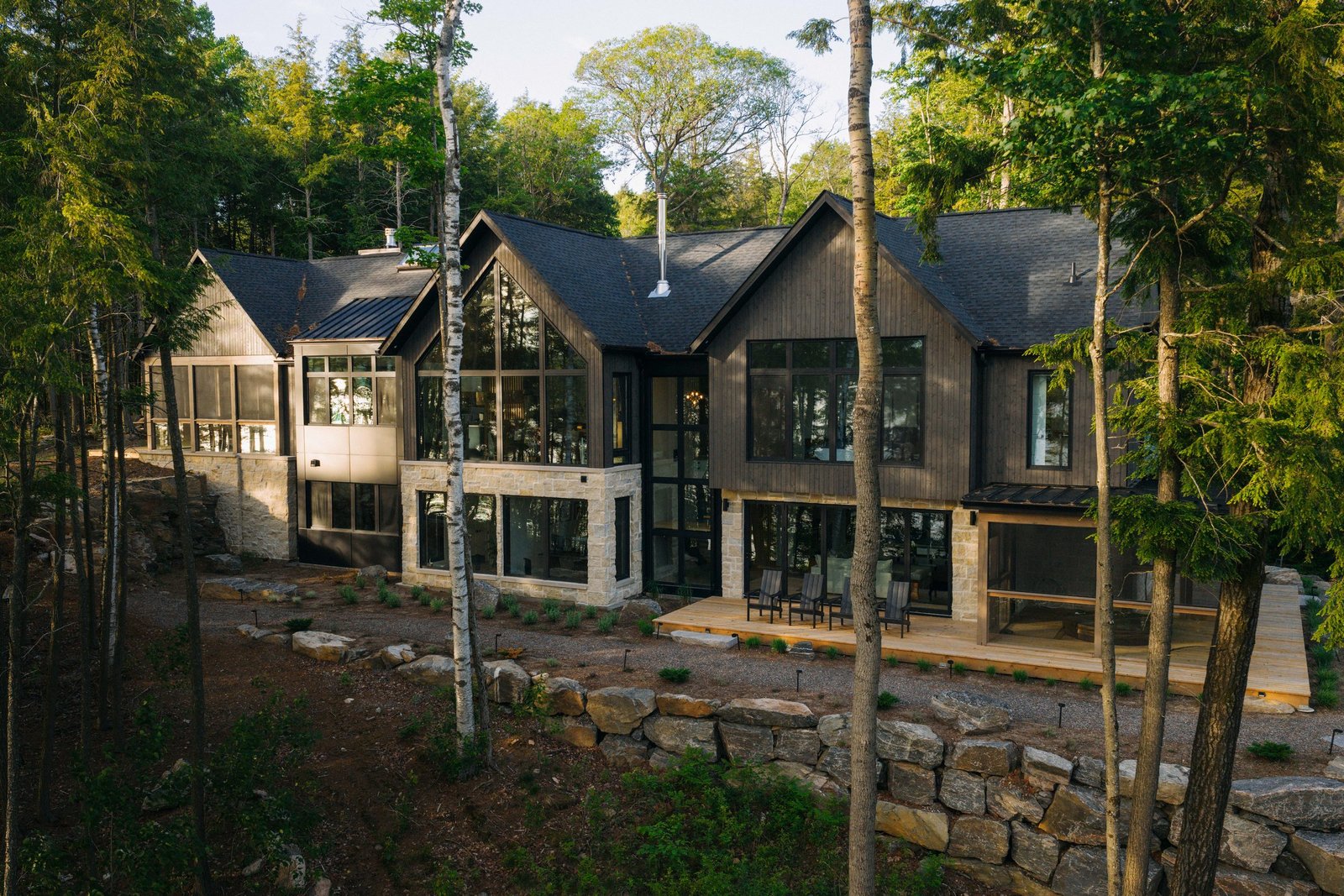 Screened porch and deck overlooking the forest toward Haliburton Lake